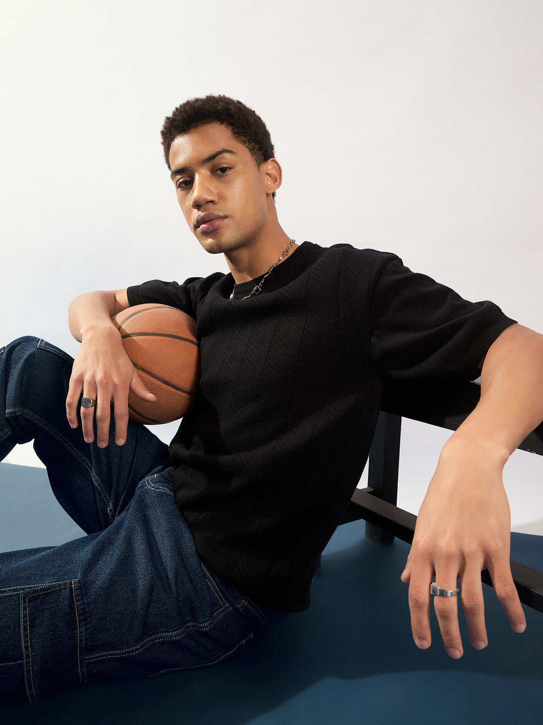 Black: Relaxed Round Neck Knitted T-Shirt