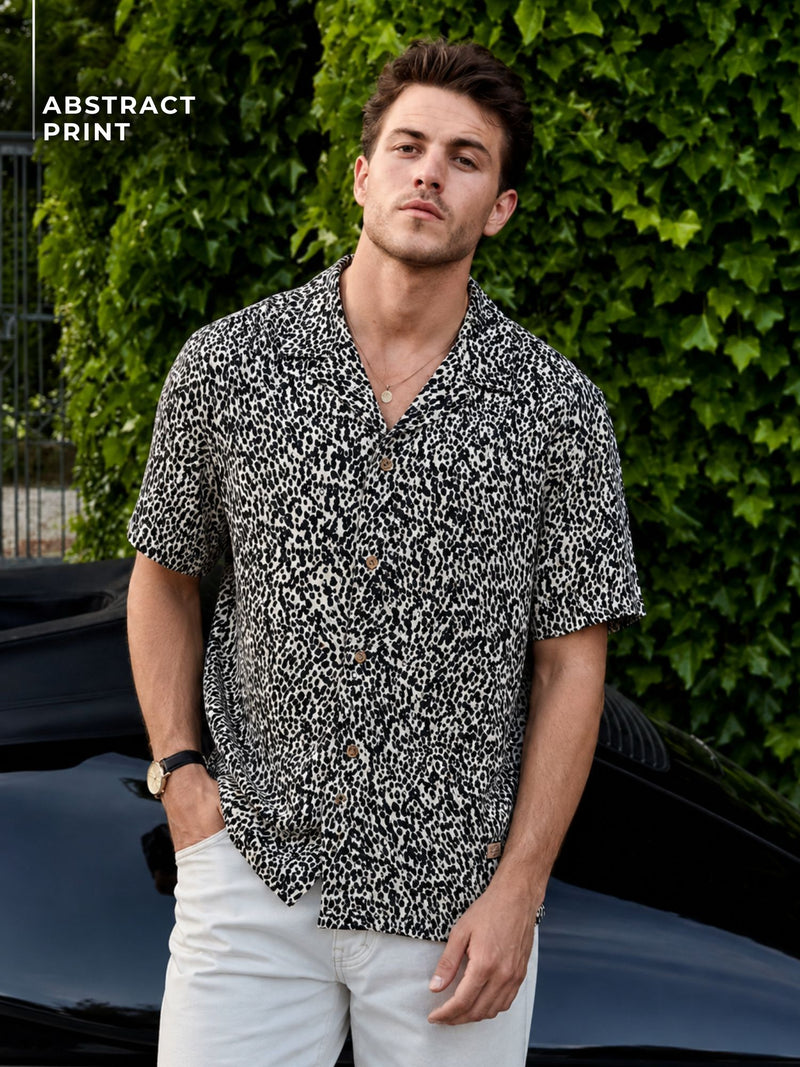 Cream & Black: Half Sleeves Cuban Collar Abstract Printed Shirt