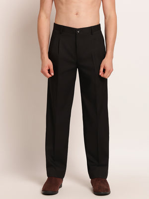 Black pants worn by a person on a plain background